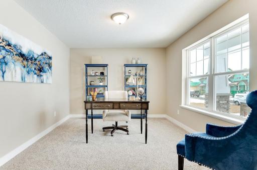 The study off the front entry is perfect for your home office or kids playroom, etc.. (Model home photo, actual home will vary in colors and materials.)