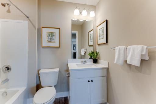 A half bath is located on the main level. Photo is of model - colors may vary.
