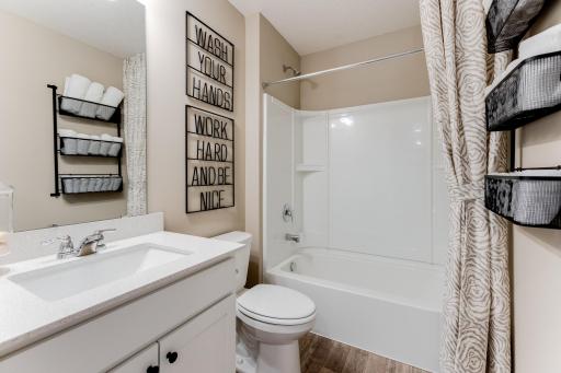In addition to the owner's bath, the upper level also features this full bathroom to go with a pair of secondary bedrooms. Photo is of model - colors may vary.