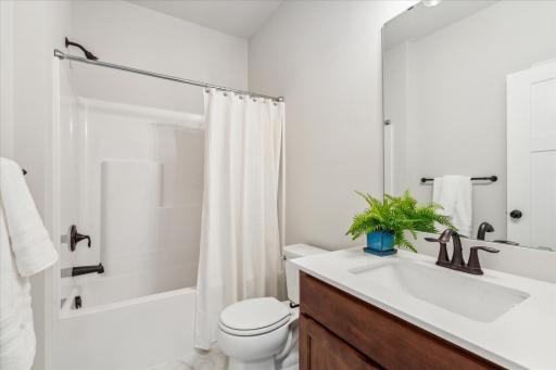 A full bathroom with tub/shower is located near the front bedroom, off the foyer.