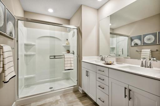 An extension of the primary suite, this private bath contains a double-vanity for early mornings! *Photos of model home; colors and finishes will vary.
