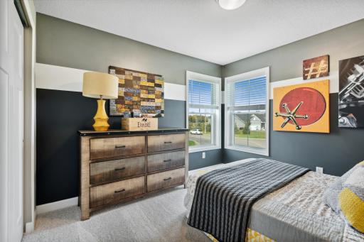 Secondary bedroom with great natural light! *Photos of model home; colors and finishes will vary.