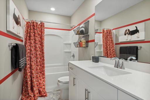 The home's secondary bath features a vanity with extra space to help keep everyone moving during those busy mornings. *Photos of model home; colors and finishes will vary.