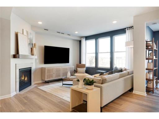 The Ashton living room has more than enough leg room for any furniture configuration you may want! Photo of model home.