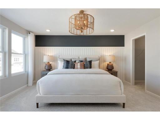 Welcome to the Primary Bedroom. The Ashton bedroom is a calming oasis and the perfect retreat at the end of the day! Photo of model home.