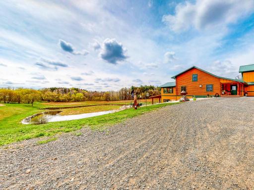 Home is situated overlooking a pond - 25 acres to call home!