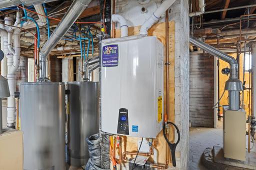 Newer ON-DEMAND Water Heater and Storage Room