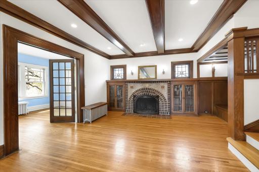 Living Room features hardwood floors..beamed ceilings..fireplace with built-in bookshelves