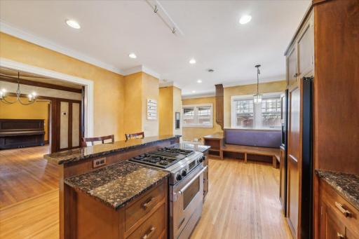 Contemporary Kitchen features hardwood floors ...built-in bench
