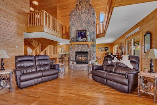 Living Room Features this Stunning Stone Fireplace for those Chilly Nights.