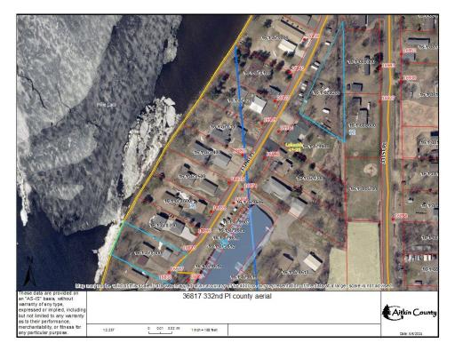 County aerial image shows approximate shape/terrain of lot(s) and is not guaranteed or deemed to be accurate and is not a survey. Image shows the lake lot, the harbor slip, and the shared "outlot", all highlighted in light blue.