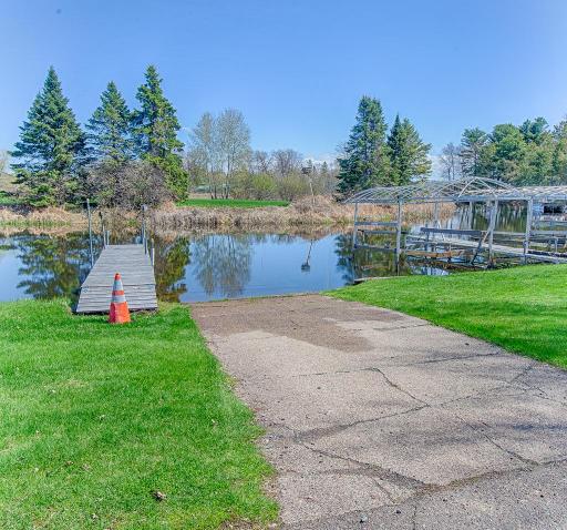 Just across the street you will also be able to enjoy the calm harbor waters off the main lake with this private dock/slip that comes with the property!