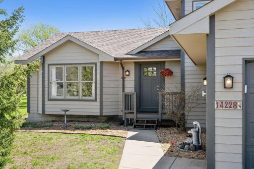 Photo for 14228 Sherburne Circle, Becker, MN 55308 - listing #6531279 Inviting front entry to the home surrounded by freshly mulched gardens.