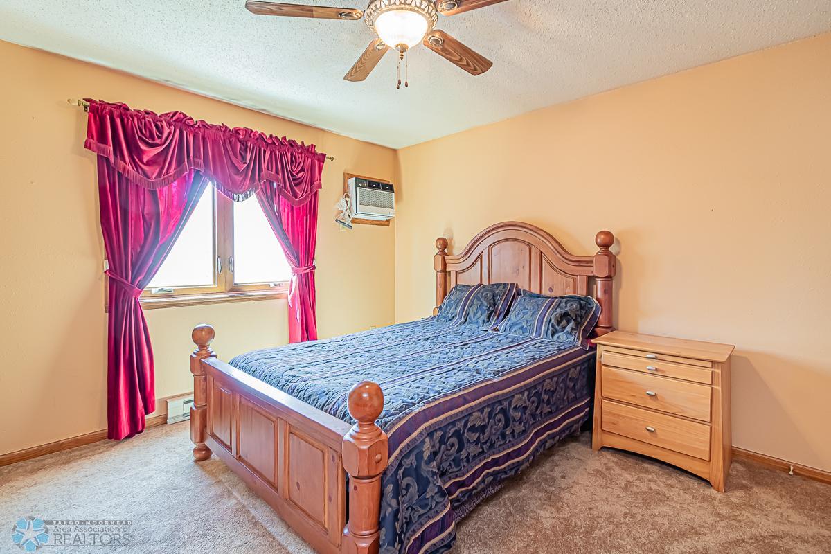 Primary Bedroom with WIC & Hollywood Bath; Newer windows throughout home! Home has 2 new Wall AC Units plus Mitsubishi Mini-Split