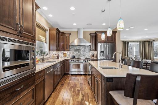 Additional highlights include garbage disposals in both the main and prep sinks, custom beech cabinets, under-cabinet lighting and outlets, and a new Bosch dishwasher installed in 2023.