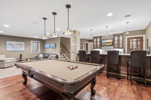 The space also offers the option to keep a pool table and shuffleboard, providing endless entertainment possibilities.