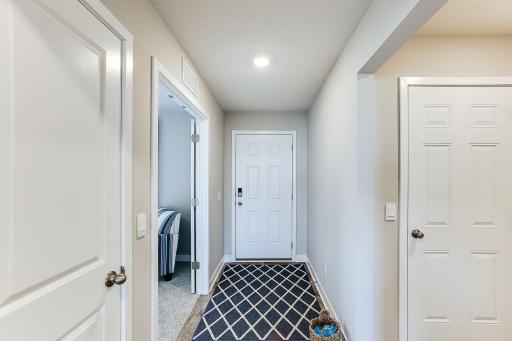 A spacious entry with a flex room separated by double doors to use a home office or play room!
