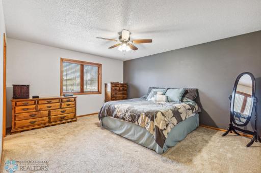 upper level primary bedroom with bath and w/in closet