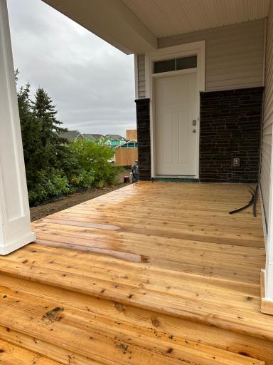 Huge, Cedar porch! *Photo is not of actual home for sale, but the home under construction will have the same porch.