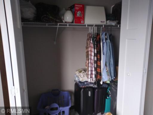 Double doored closet has room for all of the stuff
