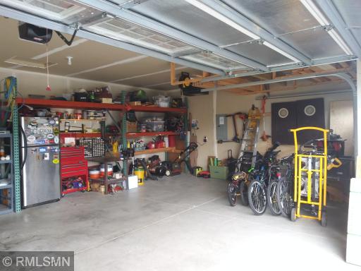 Insulated sheetrocked garage has plenty of room for all of the kid stuff and your man stuff! Storage racking is negotiable.