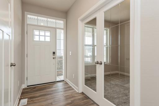 First impressions matter and this home features sophistication at the front door. This impressive foyer provides an open feeling while having an office space tucked off the front entrance.