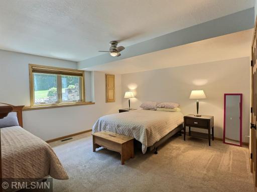 Wonderfully spacious, the second bedroom located on the lower level also offers fantastic views of the lake.