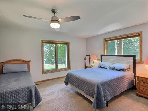 Your guests will have plenty of privacy in one of two bedrooms located in the lower level offering lake views.