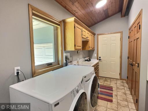 Situated right off the triple garage is the laundry room including cabinets, large closet and a laundry sink.