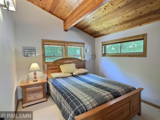 Turn-in for the night in one of the two bedrooms located in the upper level, vaulted ceiling is a wonderful feature.