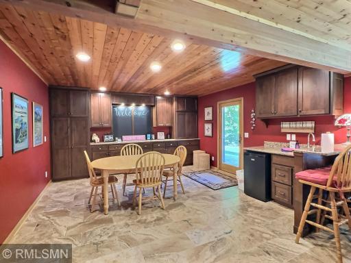 Entertain in the wet bar area including a door that opens to the lakeside, this is what lake life is all about.
