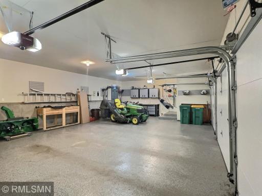 The triple garage offers so much space for your vehicles, lawn equipment and is insulated...great for winter!