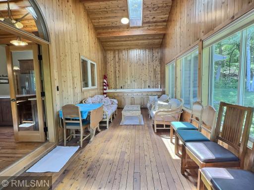 Have more than enough of seating room in the three-season porch, a skylight offers even more natural sunlight.