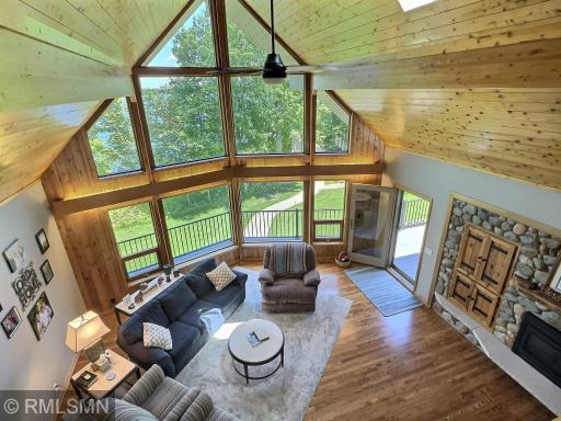Framed in natural woodwork showcasing floor-to-ceiling windows, you will be able to capture stunning sunrises.
