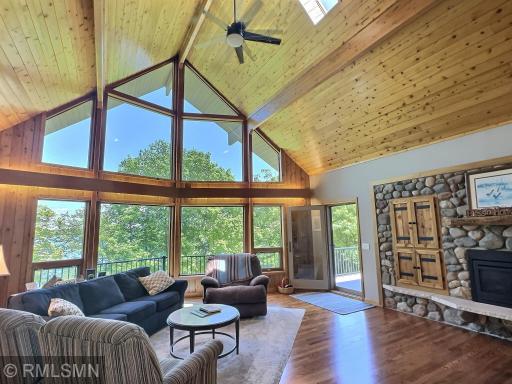 Bring the outdoors in while displaying awe-inspiring lakeshore views from the main level vaulted living room.