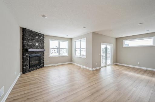 (*Photo of similar home, actual homes colors and finishes will vary) The spacious and open-concept main level allows for optimal versatility and comfort.