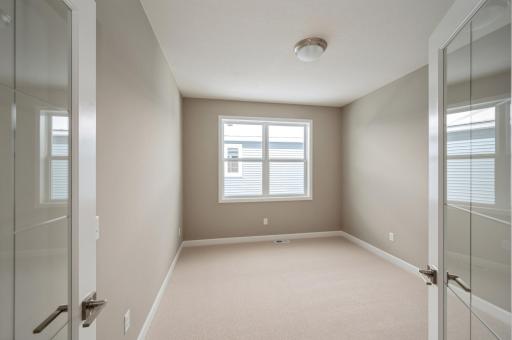 (*Photo of similar home, actual homes colors and finishes will vary) Located just off the foyer, this main level flex room provides endless opportunities
