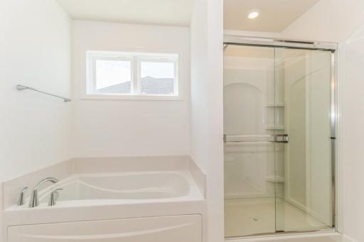 Photo is of the actual home. Another view of the primary bath.