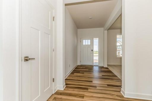 Photo is of the actual home. Make the best first impression with this bright and open foyer.