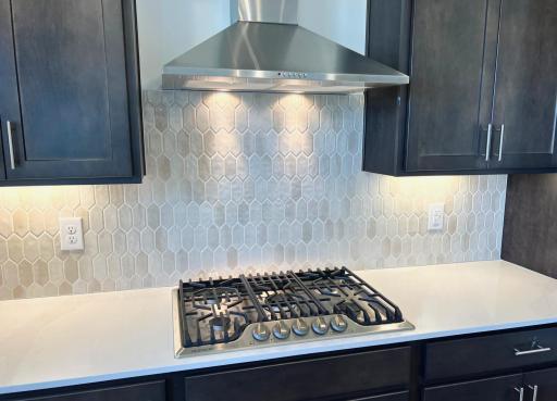 Photo is of the actual home. The gorgeous backsplash!