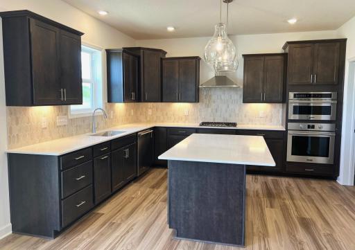 Photo is of the actual home. Welcome to the Lewis! Imagine preparing a wonderful meal for dinner in this kitchen or entertaining friends and family over the weekend!