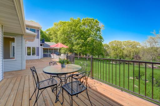 Cedar Decking with Maintenance Free Iron Railings allows for warmth and entertainment to be brought outdoors overlooking peaceful landscape