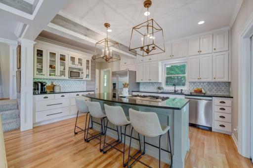 Custom Beam Millwork, Freshly Enameled Cabinetry, and Custom Details everywhere you look