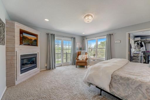 Private Primary Bedroom Suite Retreat complete with a gas fireplace for winter evenings and a Romeo & Juliet Balcony Terrace with sliding French Doors for coffee in your PJ's