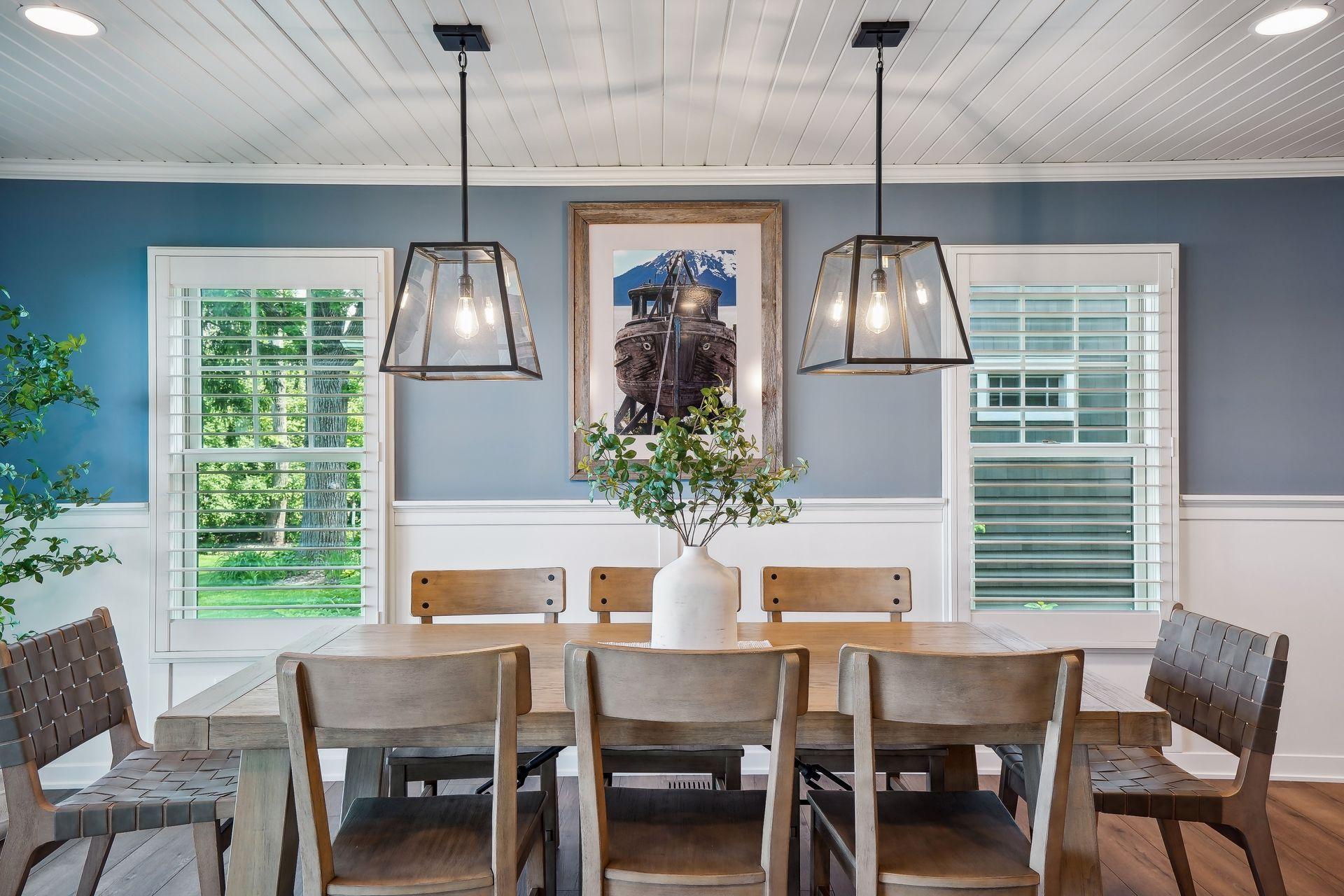 dining adjacent to kitchen and living area new shutters throughout home