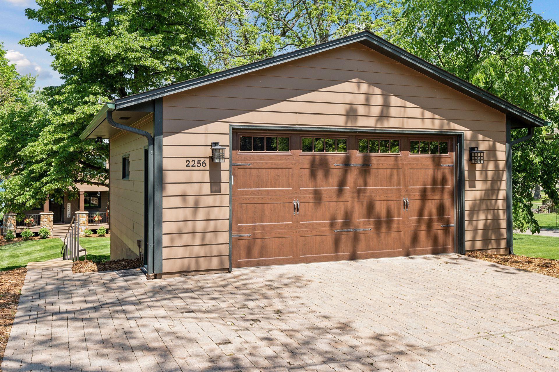 larger 2 car garage with new door