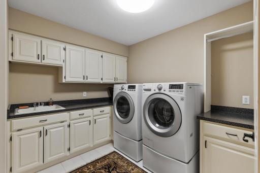 Upper Level laundry room with utility sink.