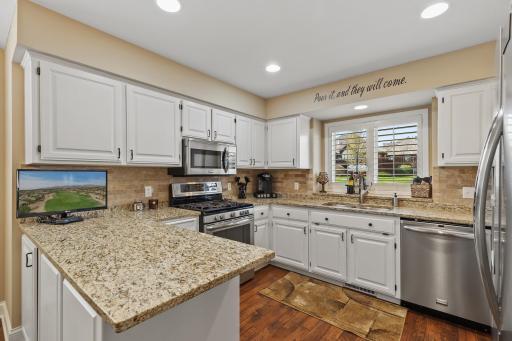 Stainless appliances, granite countertops and plenty of prep space.