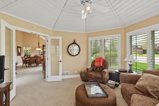 Surrounded by windows, custom ceiling detail and French Doors - the perfect spot to relax.