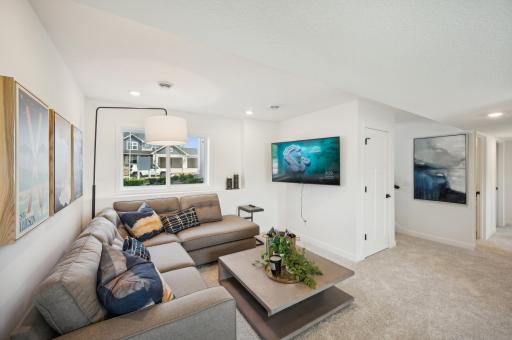 Head downstairs to an additional living space, perfect for movies or game night
